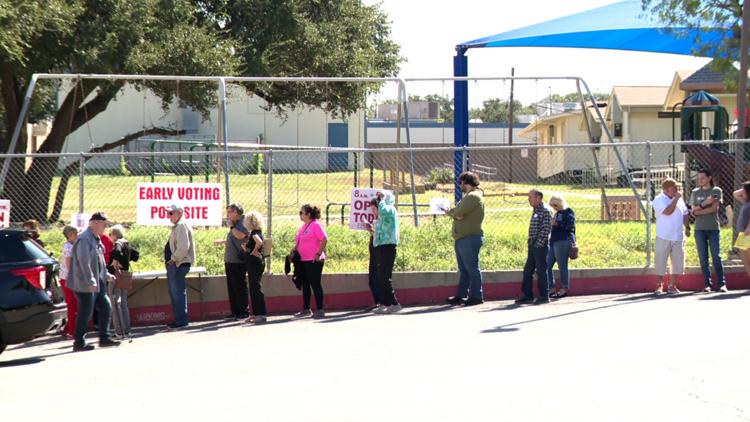 Bexar County voters lining up at an early voting polling location